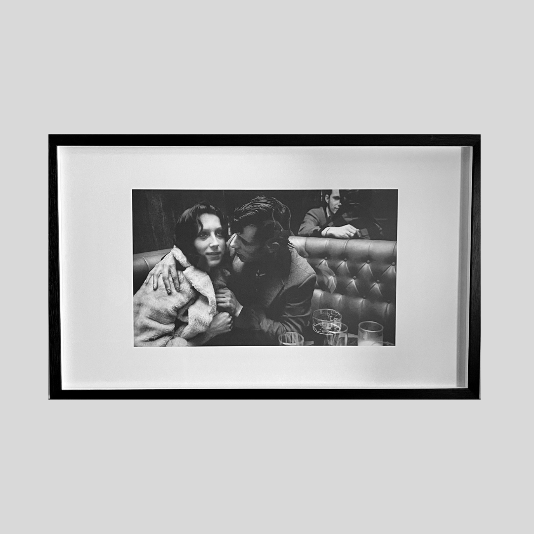 Large framed black and white photograph of a British couple in traditional bar or pub setting