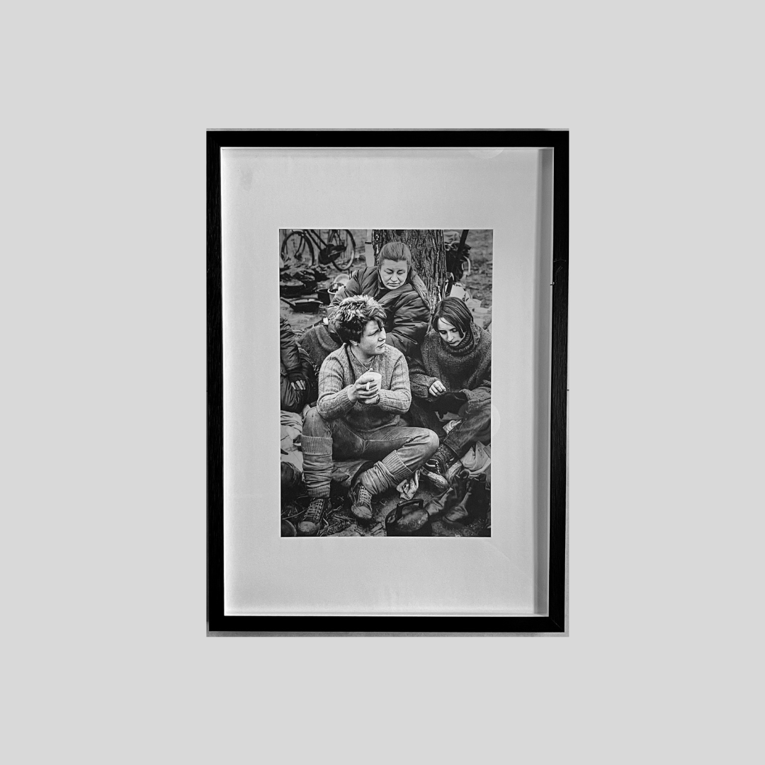 Medium black and white print showing women in classic British working life portrayal.