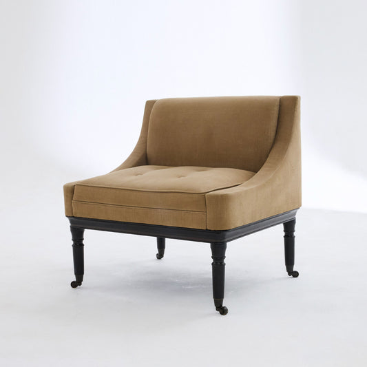 A classic buttoned armchair in beige fabric on wooden legs 