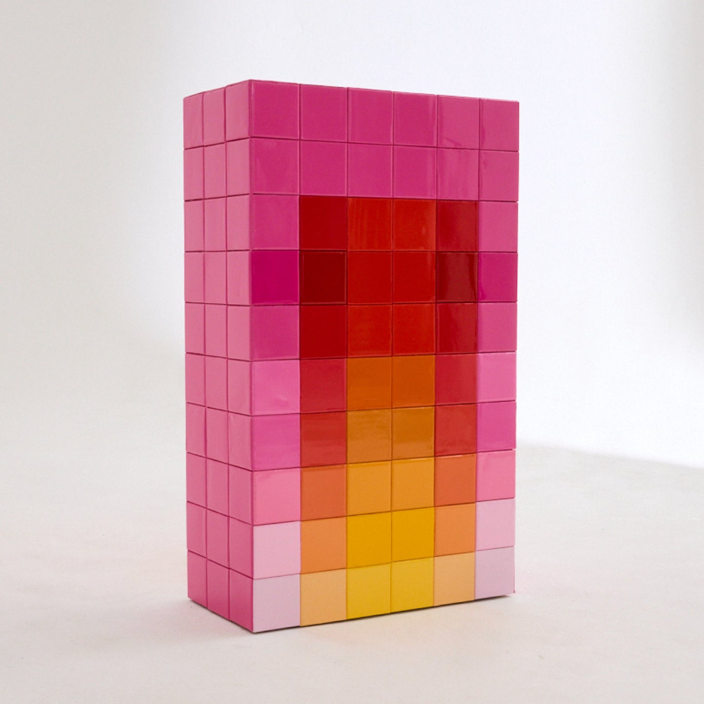 Tall gloss tile plinth in pink, red and yellow. From Mulberry 2022 festive windows.