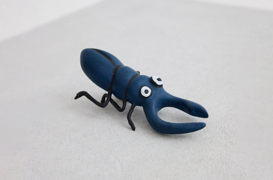 Blue mini bug sculpture from Fortnum and Mason Christmas 2022 window campaign